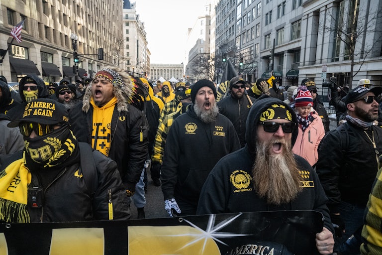 A bunch of Proud Boys (mostly white men dressed in black and yellow) chant on the streets of Washington, D.C. on Trump’s inauguration day.
