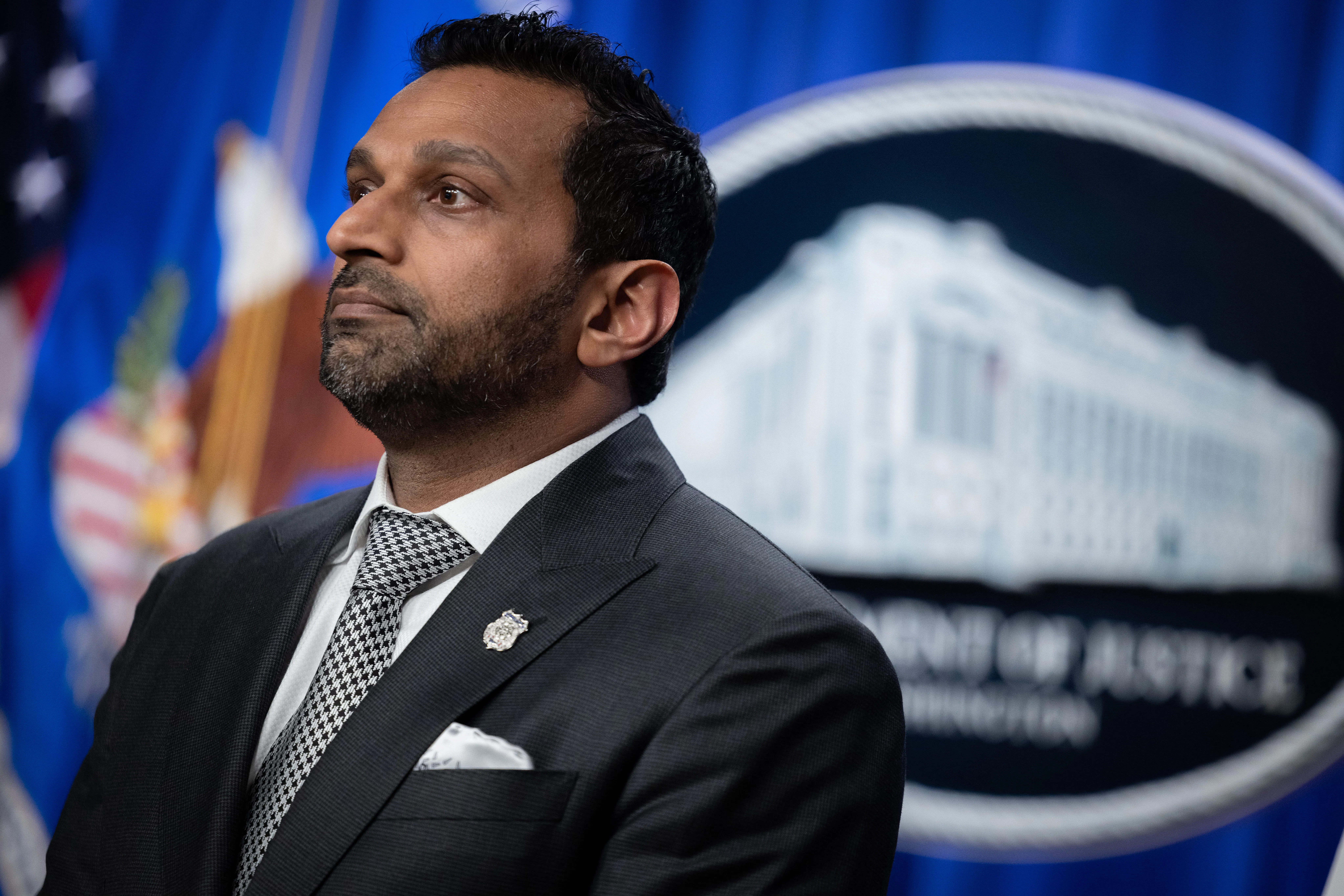 FBI Director Kash Patel stands during a press conference