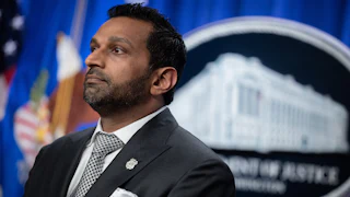 FBI Director Kash Patel stands during a press conference