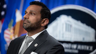 FBI Director Kash Patel stands during a press conference