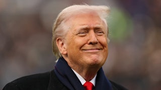 Donald Trump smiles smugly.