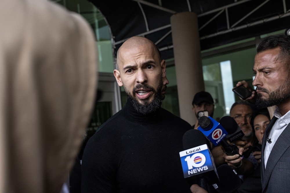 Andrew (L) and Tristan Tate arrive in the United States after a travel ban on them was lifted.