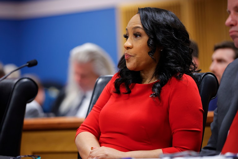 Fulton County District Attorney Fani Willis purses her lips as she sits in the Fulton County courthouse
