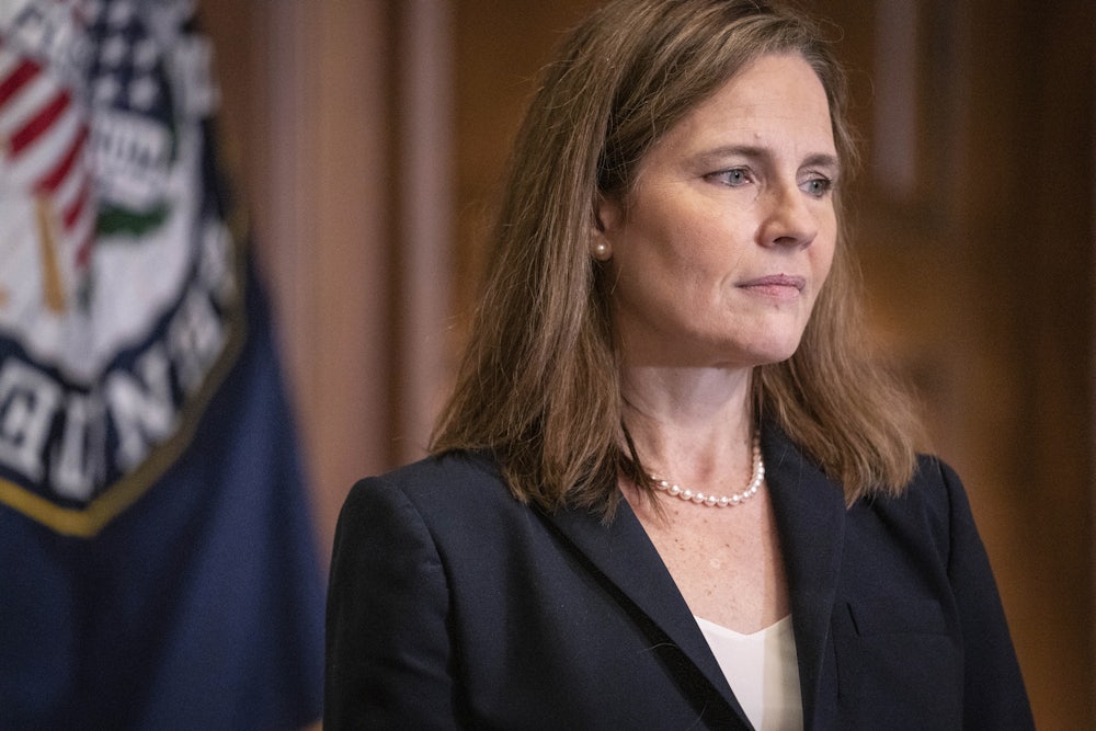 A close-up of Justice Amy Coney Barrett in profile.