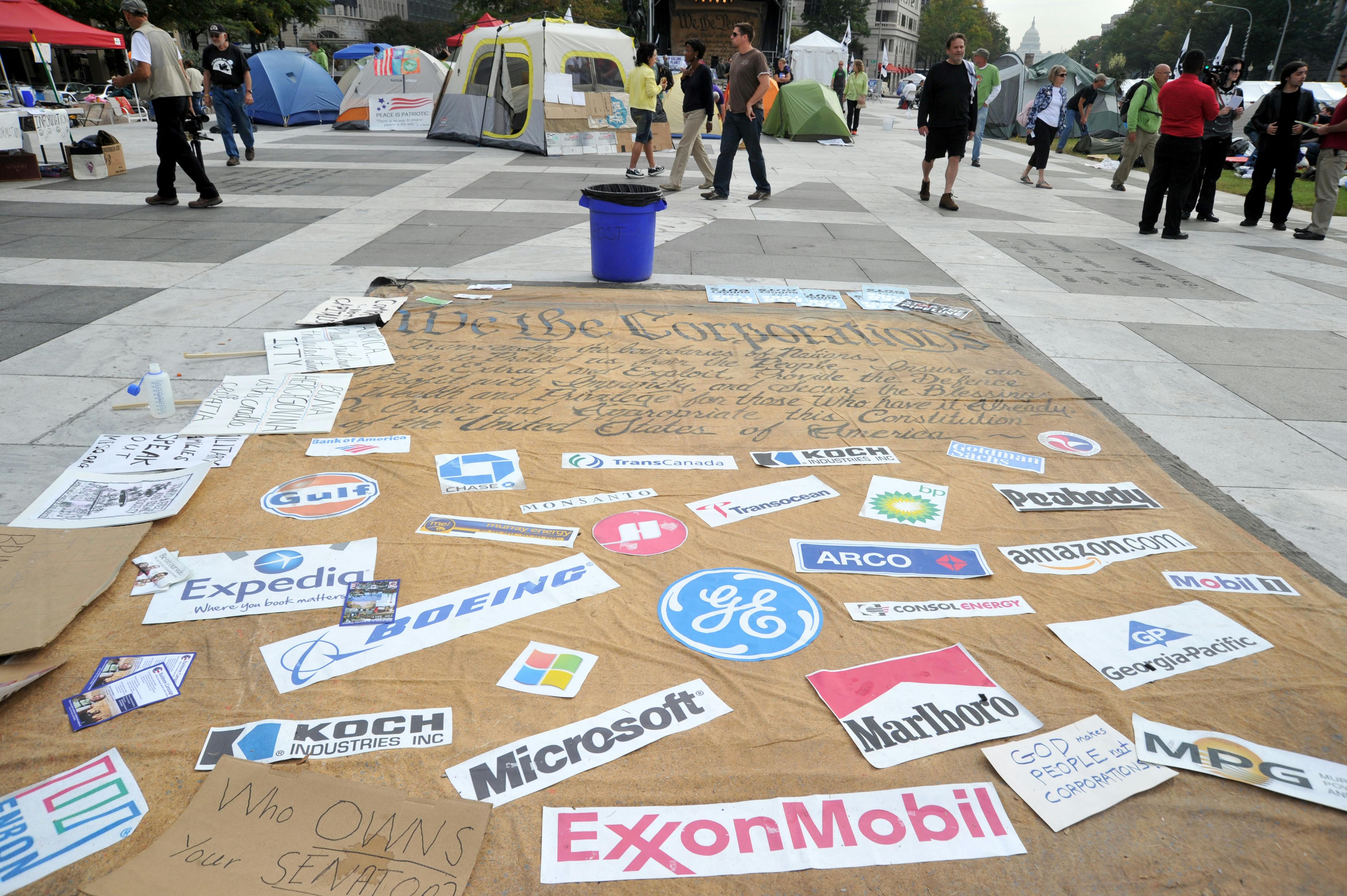 Corporation signs on a mock Preamble to the US Constitution is seen at an Occupy DC camp in Freedom Plaza in Washington, D.C. 