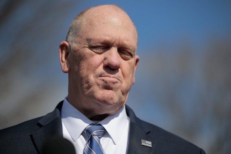 Tom Homan squints and purses his lips while speaking to reporters outside the White House