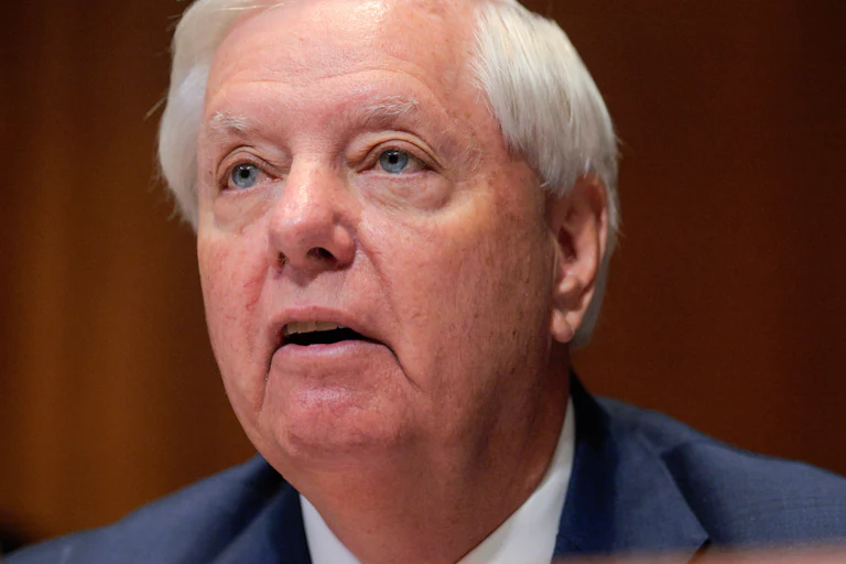 Senator Lindsey Graham looks up.