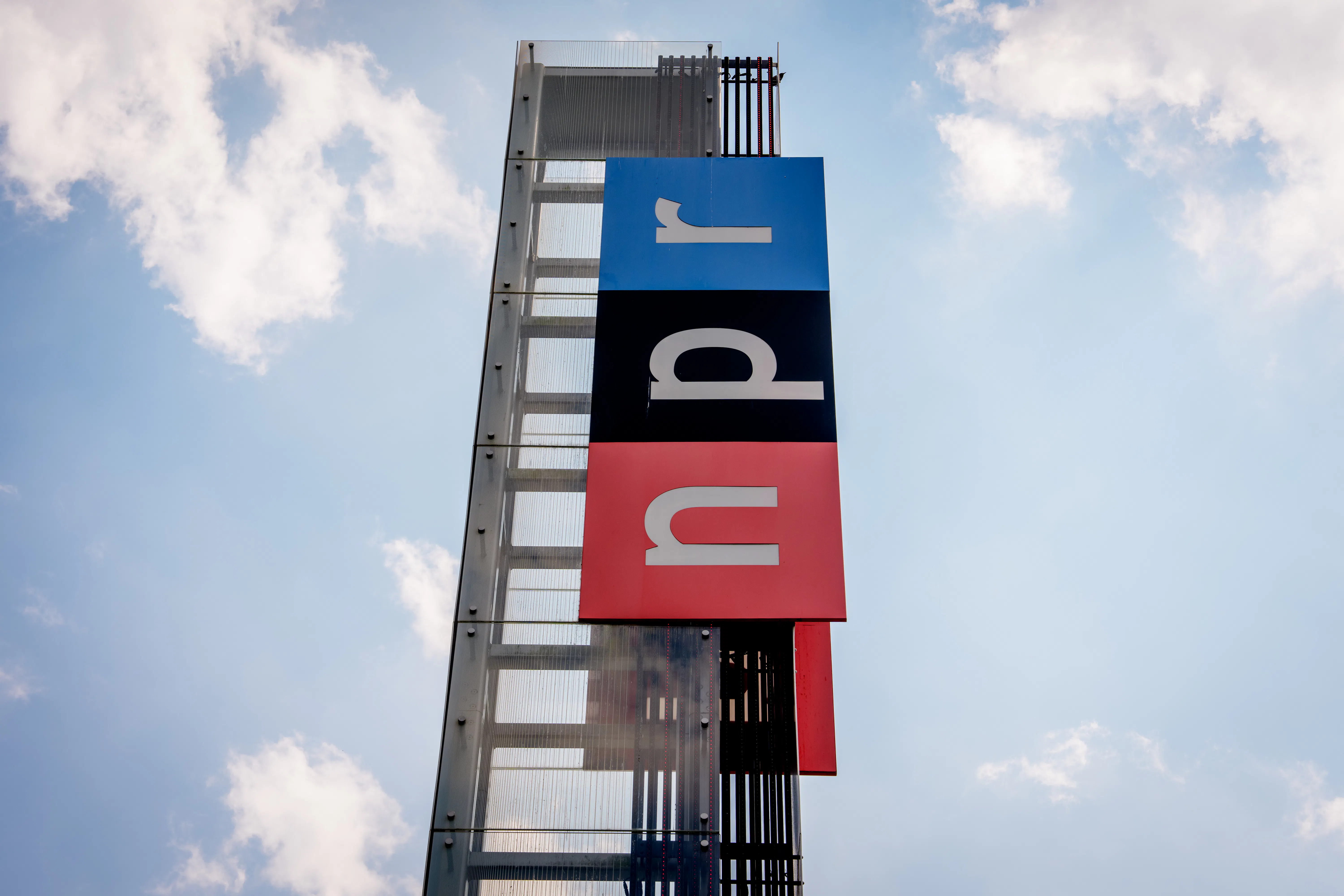 View of the sign outside National Public Radio headquarters in Washington, D.C.