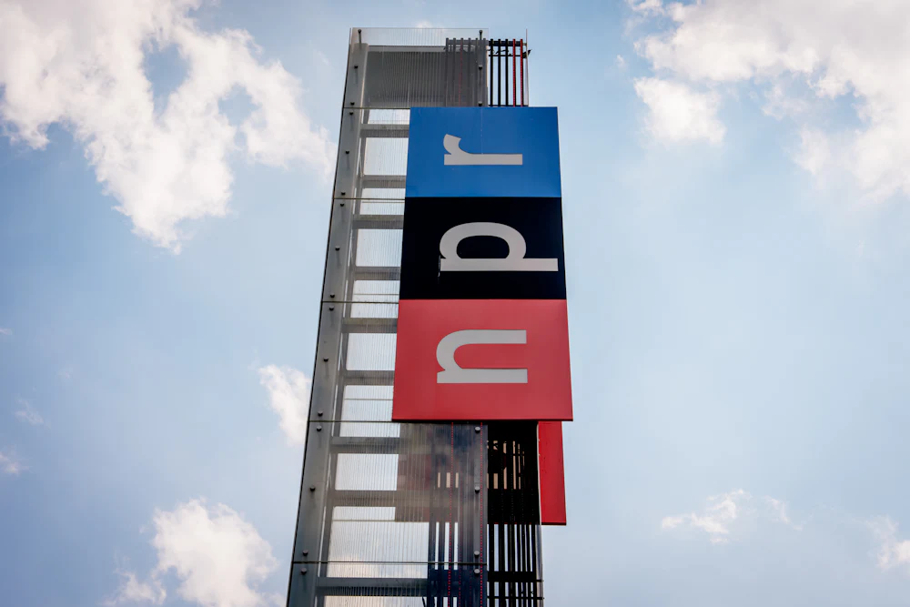View of the sign outside National Public Radio headquarters in Washington, D.C.