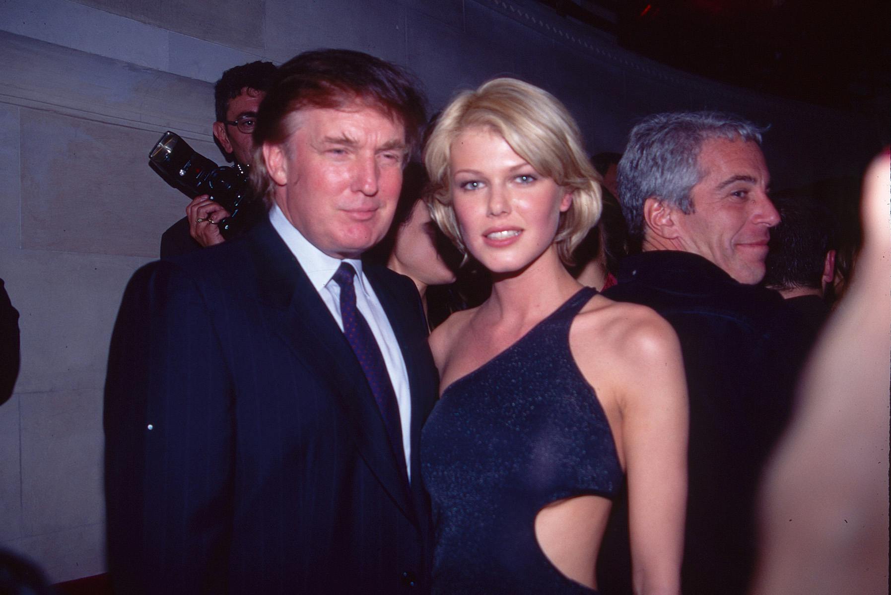 Donald Trump and Belgian model Ingrid Seynhaeve smile for the photo while Jeffrey Epstein dances in the background.