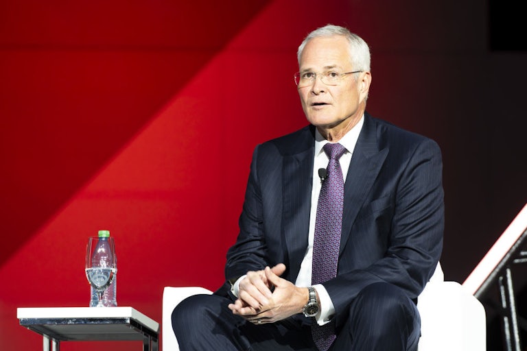 Darren Woods sits with his hands clasped.