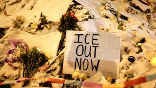 A sign at a memorial for Alex Pretti in Minneapolis, Minnesota, says, "ICE out now"