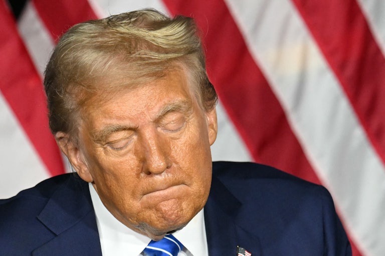 Donald Trump looks down during a campaign event