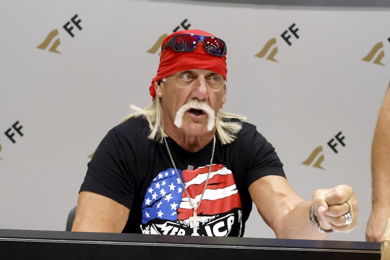 Hulk Hogan speaks while seated at a table