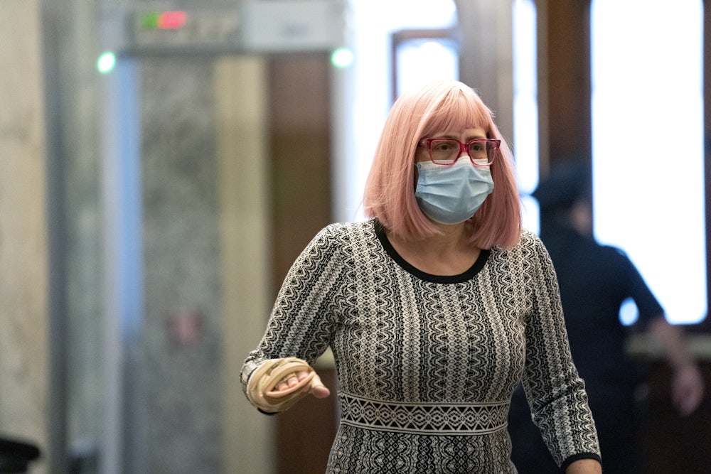 Senator Kyrsten Sinema of Arizona wears a protective mask while arriving at the Capitol on December 11.