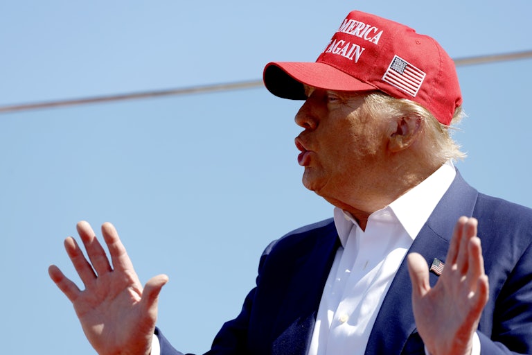 Donald Trump gestures and speaks during a campaign event