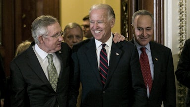 Senators Harry Reid and Chuck Schumer leave the Senate chamber with a beaming Vice President Biden in 2012 