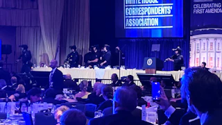 Guests and armed security agents at the White House Correspondents’ Association Dinner.