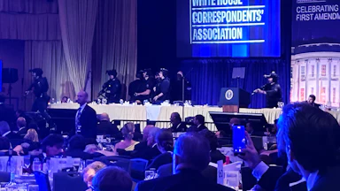 Guests and armed security agents at the White House Correspondents’ Association Dinner.