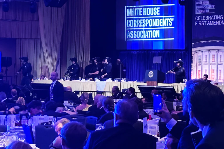 Guests and armed security agents at the White House Correspondents’ Association Dinner.