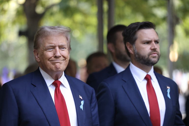 Donald Trump smiles and stands next to J.D. Vance, who is staring off into the distance with his burrows frowed