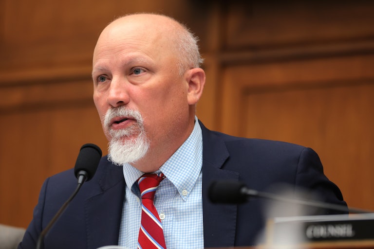 Representative Chip Roy speaks into a microphone during a House hearing