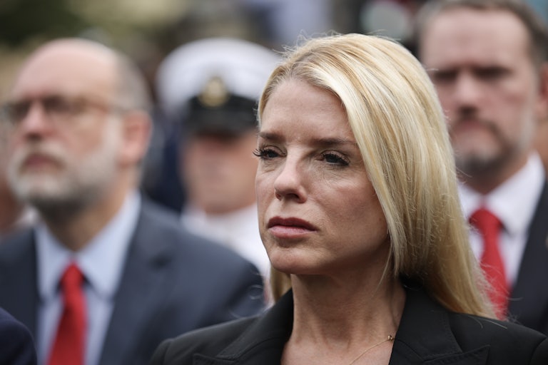 Attorney General Pam Bondi stands during a 9/11 memorial service