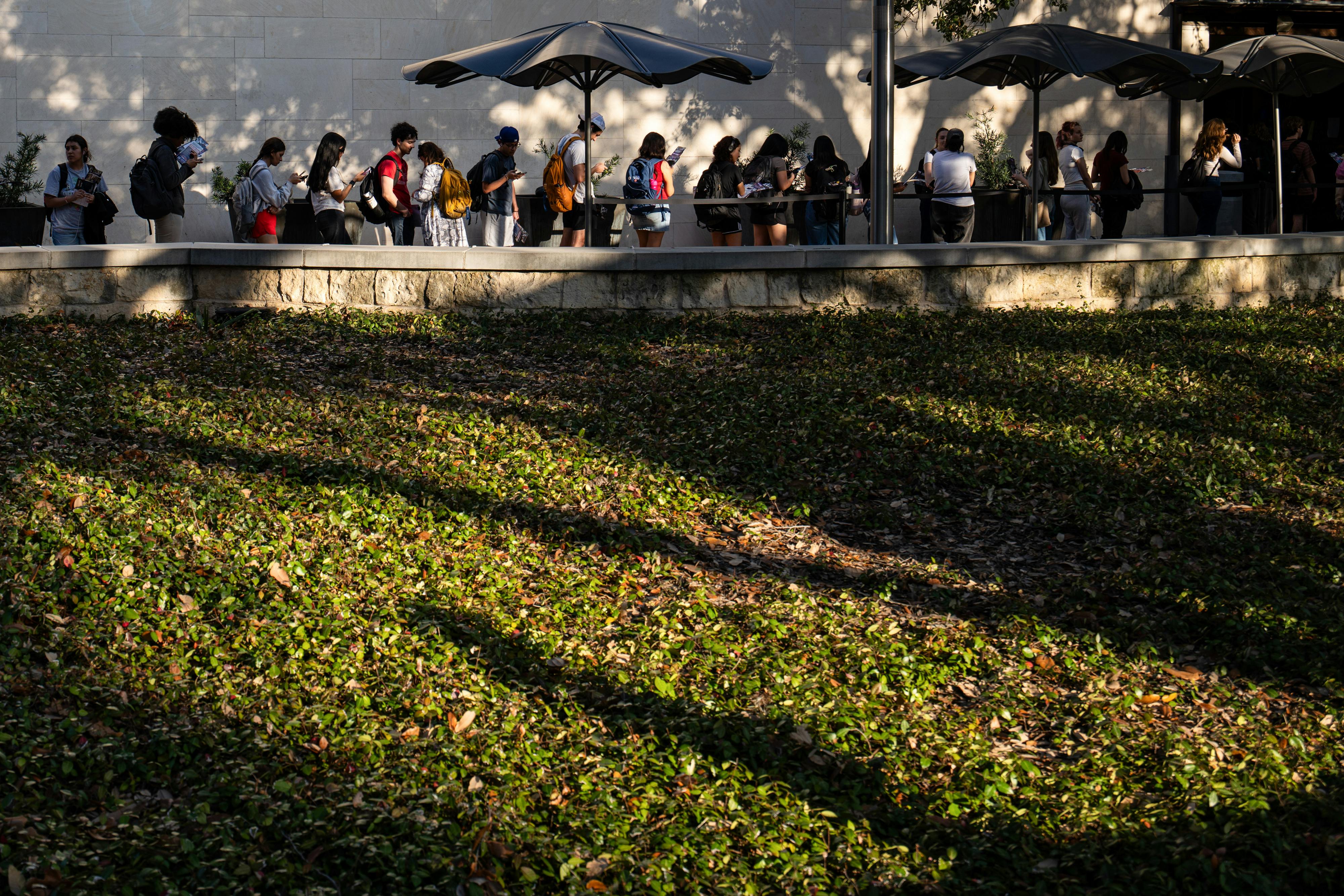 People stand in line to vote at the University of Texas at Austin.