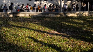 People stand in line to vote at the University of Texas at Austin.