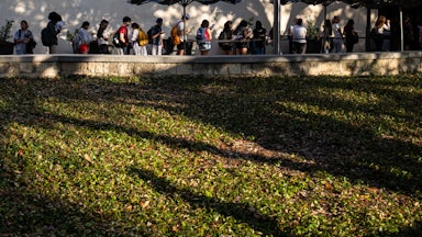 People stand in line to vote at the University of Texas at Austin.