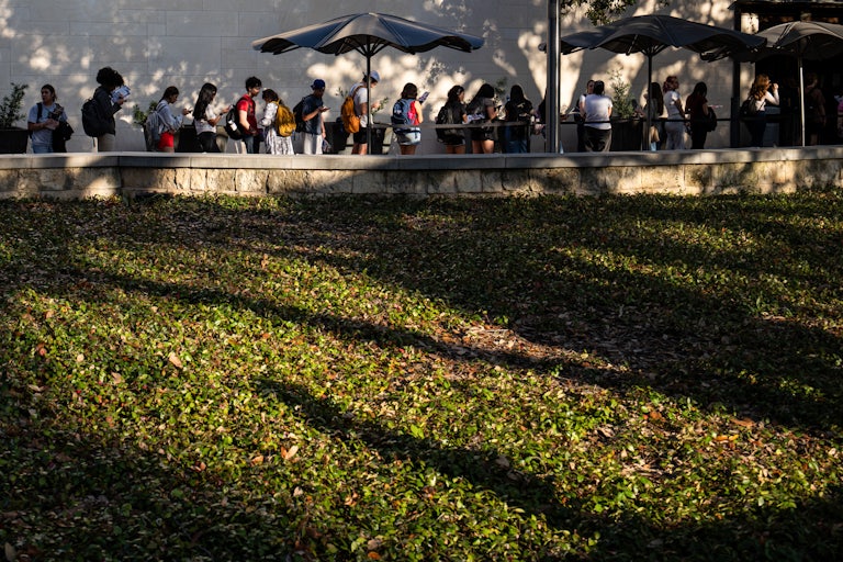 People stand in line to vote at the University of Texas at Austin.