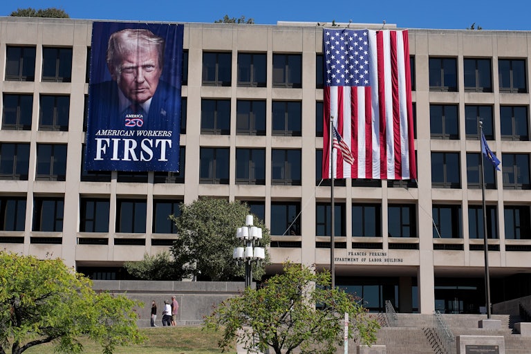 Donald Trump banner and U.S. flag hanging in front of Labor Department