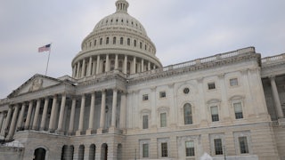 Capitol building with snow on the lawn