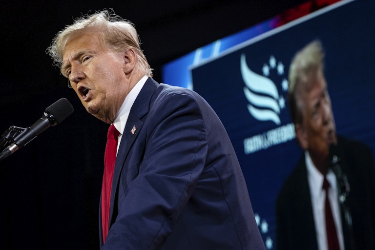 Donald Trump speaking (yelling?) into a mic