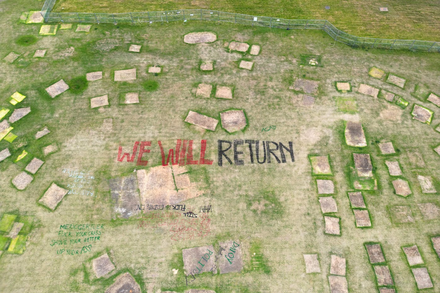 An aerial view of the remnants of an encampment on a University of Toronto lawn. 