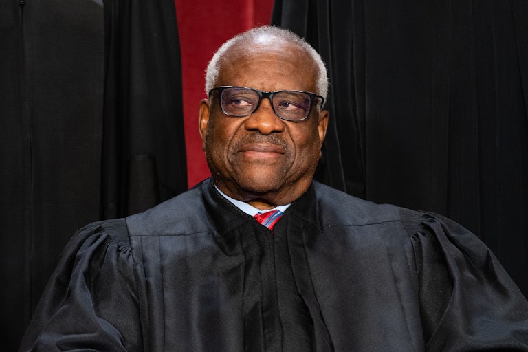Clarence Thomas looks to the side