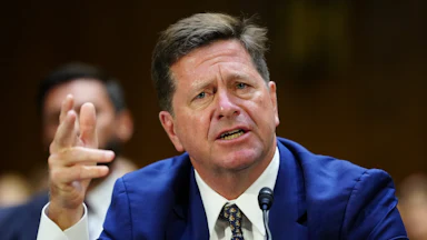 DNI nominee Jay Clayton gestures while speaking during his Senate committee confirmation hearing