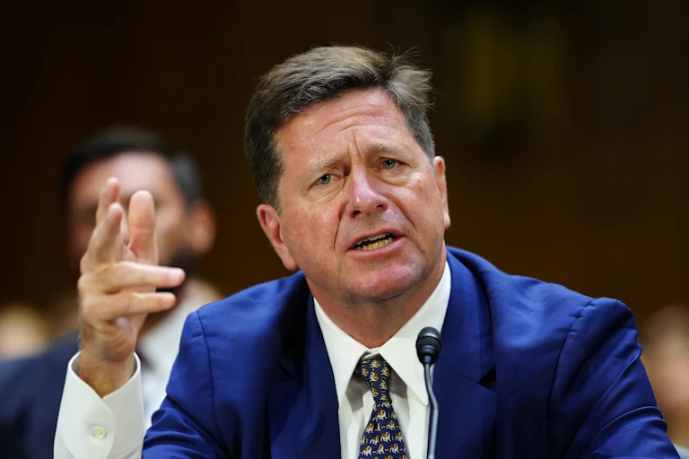 DNI nominee Jay Clayton gestures while speaking during his Senate committee confirmation hearing