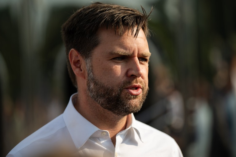 J.D. Vance speaking outside, brows furrowed in the sun