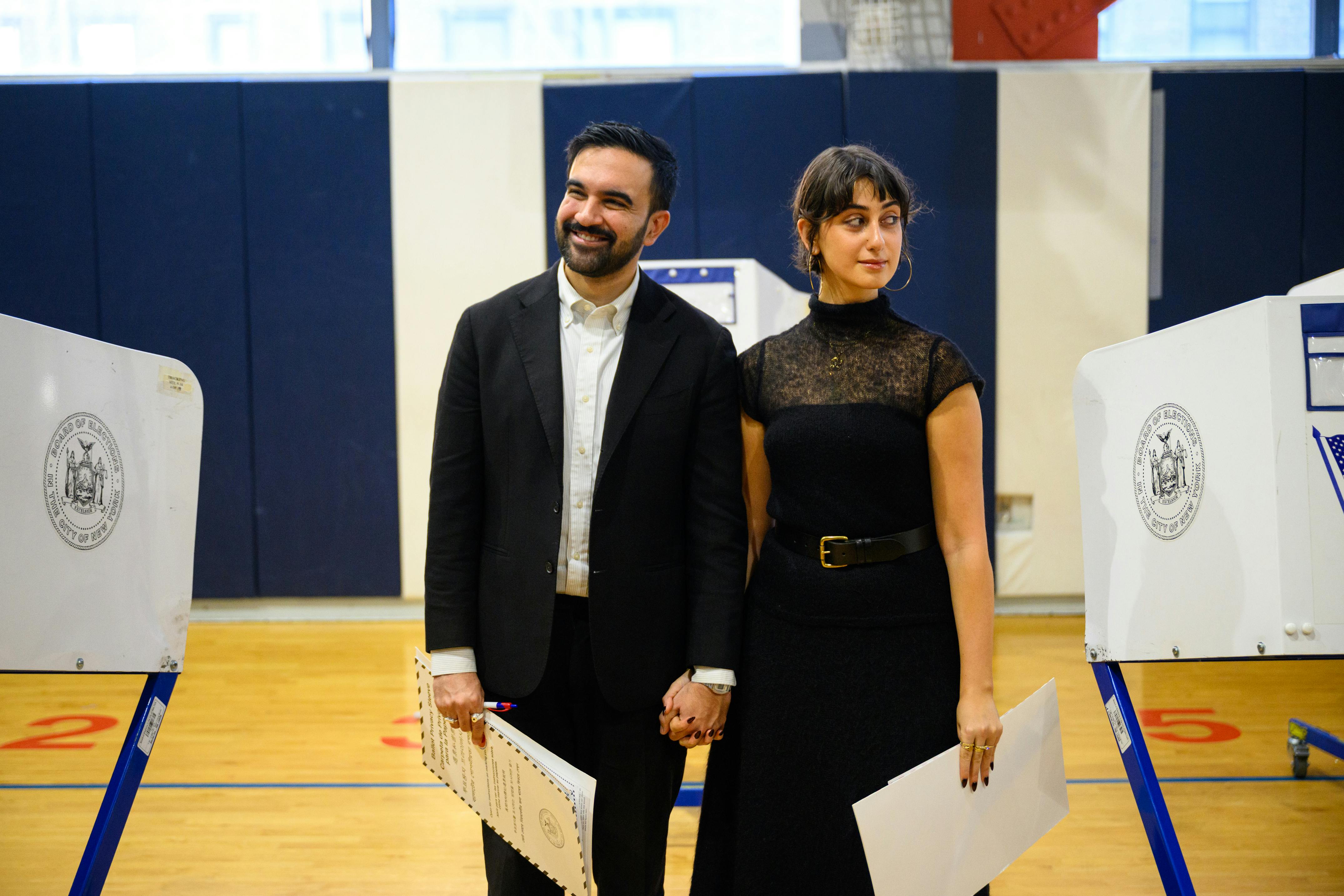 Mamdani and his wife Rama Sawaf Duwaji  voting 