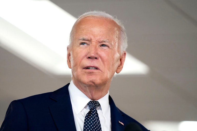 Joe Biden, mouth slightly agape and brows furrowed, looks off camera