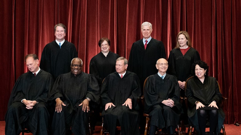 The nine justices of the Supreme Court pose for a picture.
