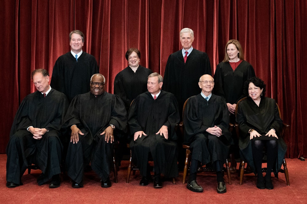 The nine justices of the Supreme Court pose for a picture.