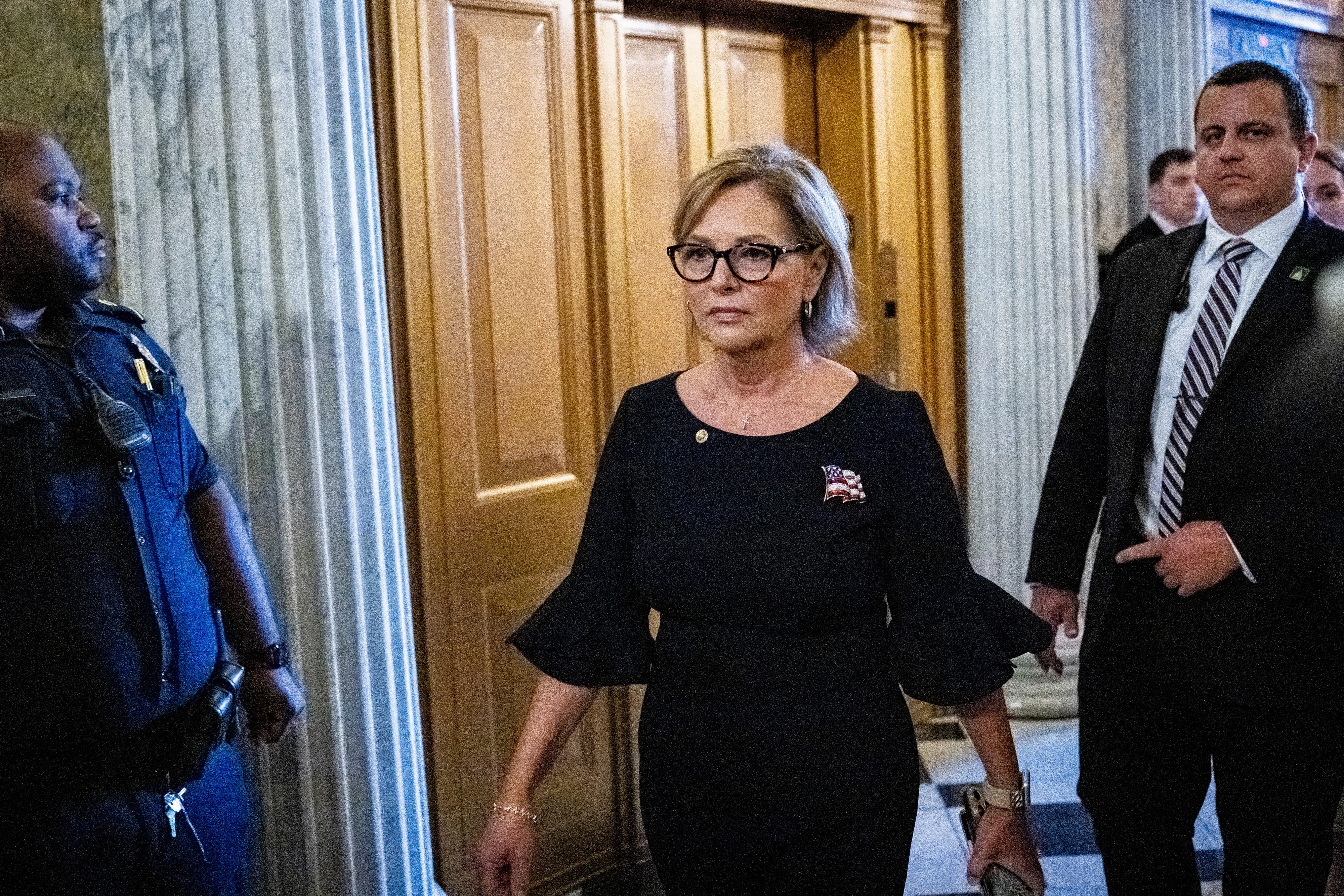 Senator Darline Graham Nordone walks in the Capitol.