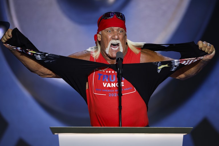 Hulk Hogan rips his shirt on stage at the 2024 Republican National Convention in Milwaukee, Wisconsin. Underneath that shirt is another shirt that reads “Trump Vance Make America Great Again 2024.”