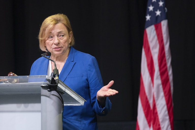 Maine Governor Janet Mills gestures while speaking at a podium