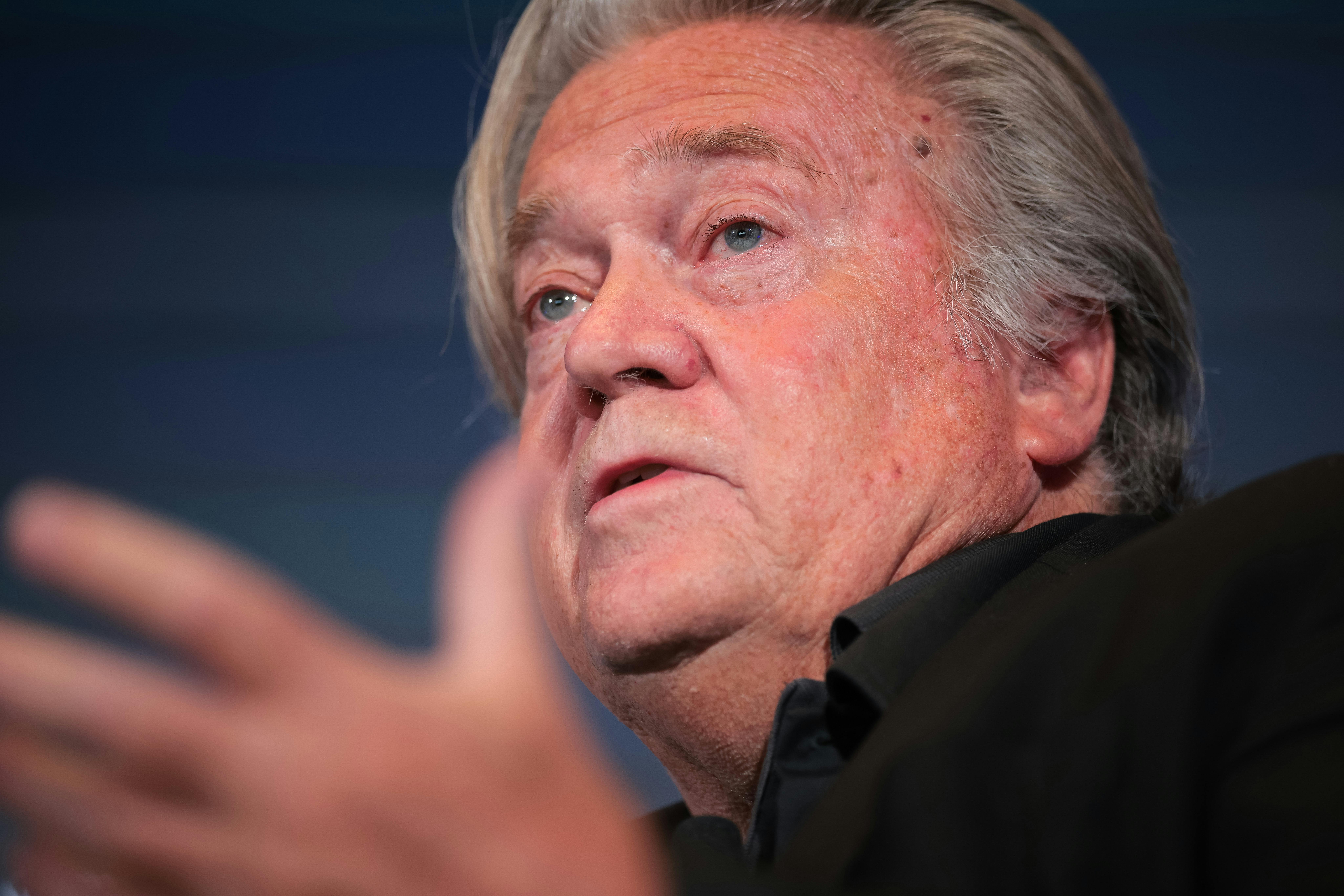 Steven Bannon gestures and speaks