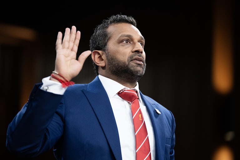 FBI Director Kash Patel raises his right hand while swearing in during a Senate committee hearing