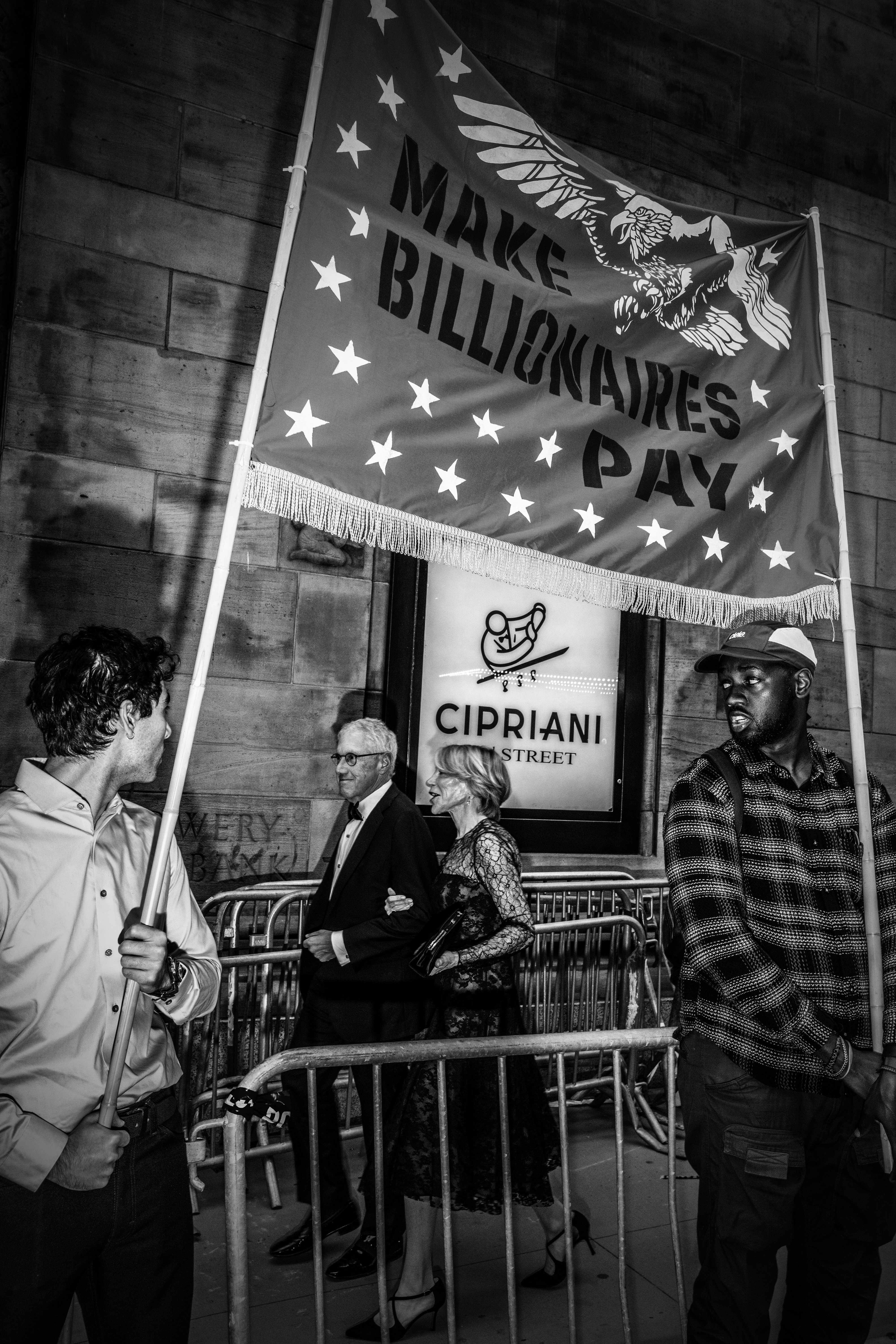 In early May, protesters forming a “billionaire blockade” confronted attendees of a dinner in New York City honoring hedge fund manager Paul Singer. The dinner was hosted by the conservative think tank the Manhattan Institute.