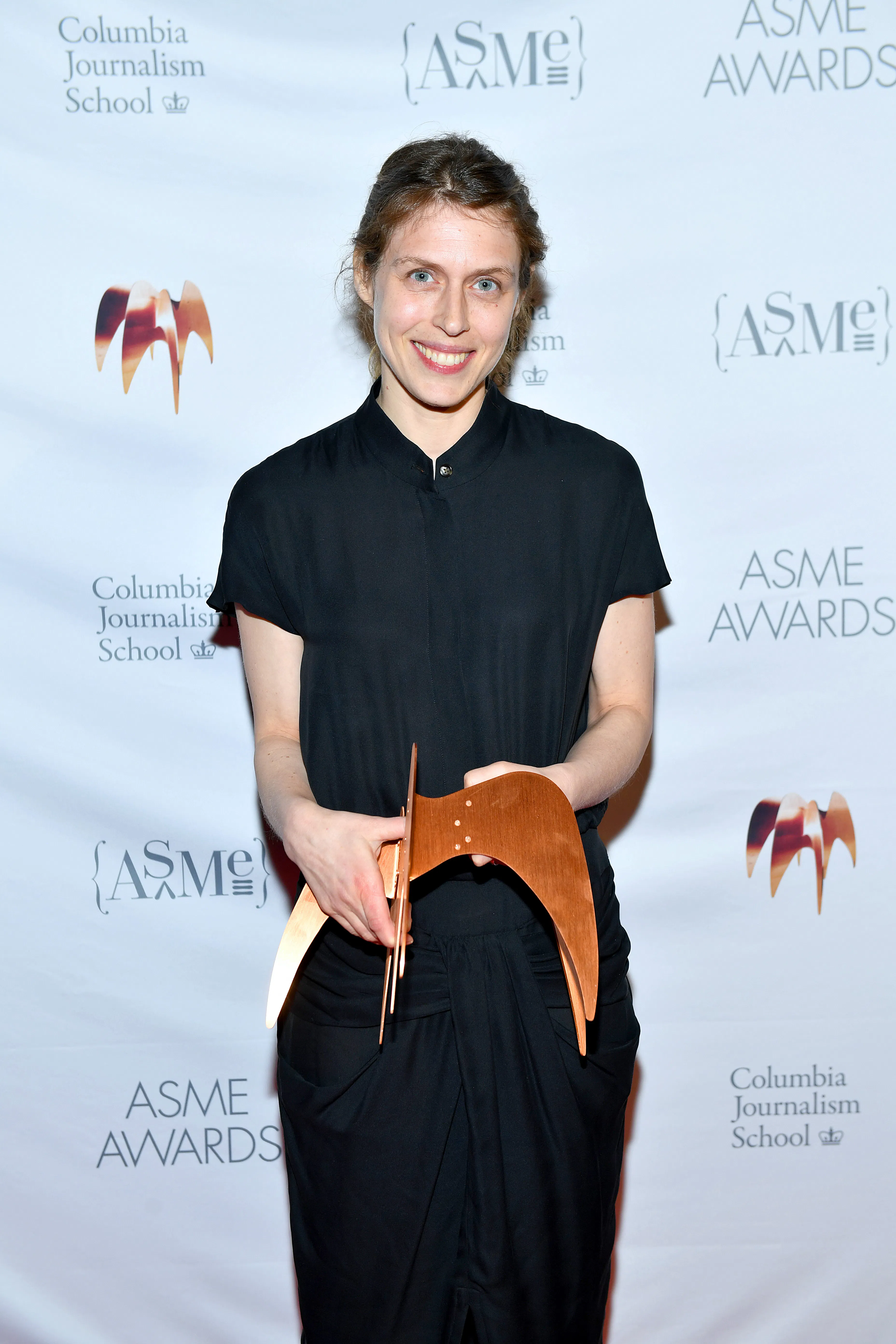 Rachel Aviv poses with an award at the Annual National Magazine Awards in New York City in 2022